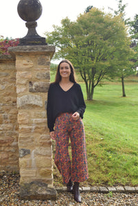 PANTALONES SOL - FLORES NARANJA -