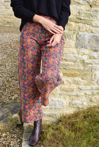 PANTALONES SOL - FLORES NARANJA -