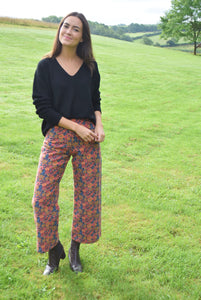 PANTALONES SOL - FLORES NARANJA -